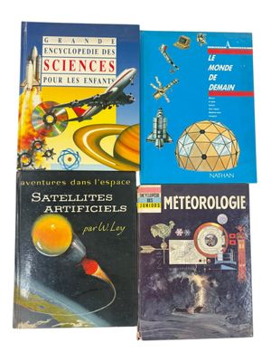 several books are stacked on top of each other on a white surface