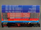 several books stacked on top of each other on a table