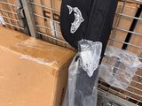 a cart with boxes and an umbrella on the ground