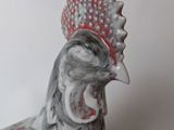 porcelain figurine of a rooster with a red crown on its head
