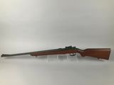a rifle with a wooden barrel on a white background