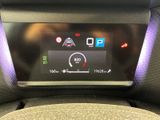 the dashboard of a car with a digital display on it