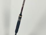 a close up of a fishing rod on a white surface