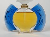 an image of a bottle of perfume sitting on a white surface