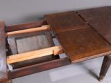 a wooden table with a drawer underneath it