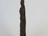 statue of a man standing on a wooden base on a white background