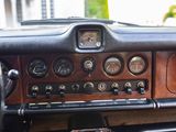 a dashboard of a car with many gauges on it
