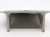 a small white table that has a small table on top of it