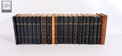 books are stacked on top of each other on a white surface
