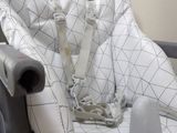 a baby seat with a seat belt attached to it