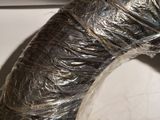 a metal pipe wrapped in plastic and sitting on a counter