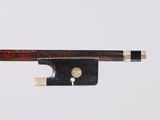a close up of a violin bow on a white background