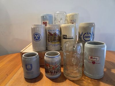 many different types of coffee mugs on the table