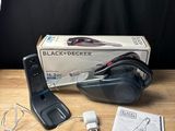 a black and decker corded vacuum on a wooden table