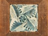 painting of a blue and white tile in a wooden frame