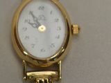an image of a close up of a wrist watch on a table