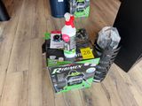 a box of cleaning products on the floor next to a pair of boots