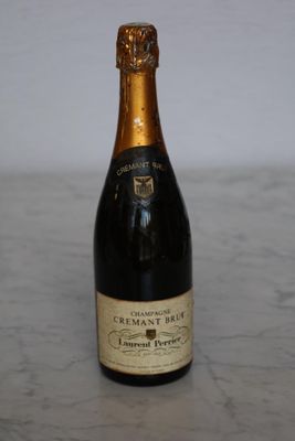 a bottle of champagne sitting on a table