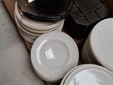 a lot of plates that are sitting on a table