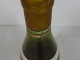 a bottle of wine that is sitting on a table