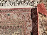 rugs and rugs are laid out on the floor in a room