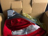the rear light of a car is in a box with other boxes