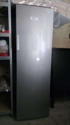 a silver refrigerator in a room with shelves and shelves