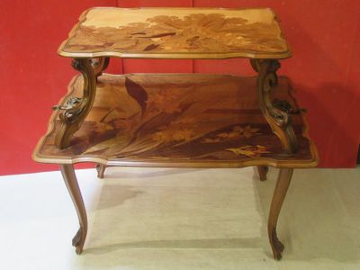a wooden table with a floral design on top of it