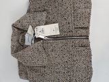 grey herringle tweed pants with zippers and a tag on the side