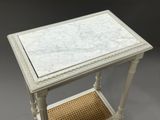 marble top end table with wicker shelf