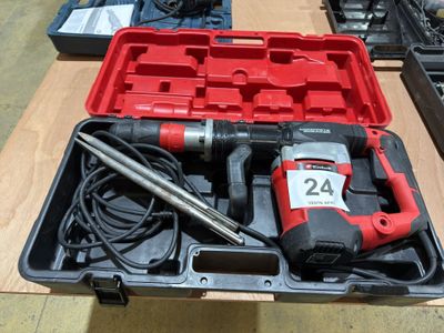 a red box with tools in it sitting on a table
