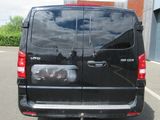 a black van that is parked in a parking lot