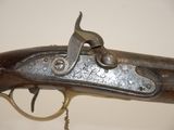 an old gun that is on display in a museum