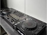a black dj controller sitting on top of a table