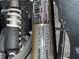 an image of a close up of a vehicle ' s front suspension