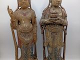 paire de statues chinoises en bois sculpté représentant un homme et une femme