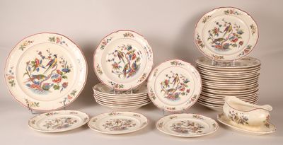 a lot of plates and bowls that are sitting on a table