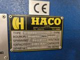 an image of a metal sign on a blue wall that says haco