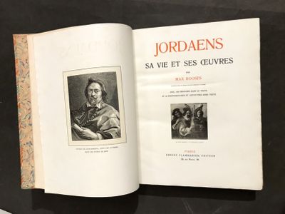 un livre ouvert sur lequel figure l'image d'un homme et d'un chien