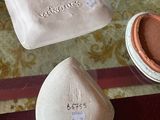 three soaps sitting on a table next to each other