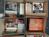boxes of books are stacked on top of each other on the floor