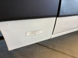 a close up of a car door with a sticker on it