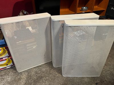 two speakers that are sitting next to each other on the floor