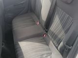 the back seat of a car with a seat belt in it
