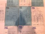 a lot of papers that are sitting on a table