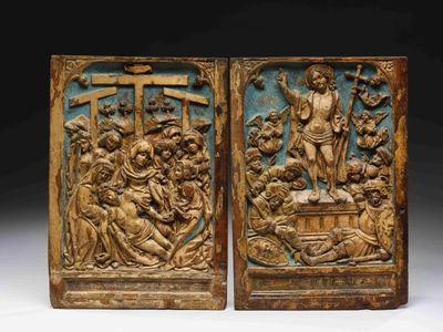 pair of carved wood panels depicting the crucifix of jesus and other religious figures