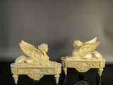 pair of carved ivory figurines of angels on a table