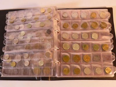 a lot of coins that are in a plastic case
