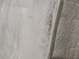 a close up of a mattress that has been wrapped in plastic