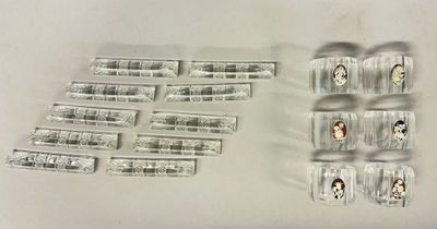a lot of pills and condoms sitting on a table